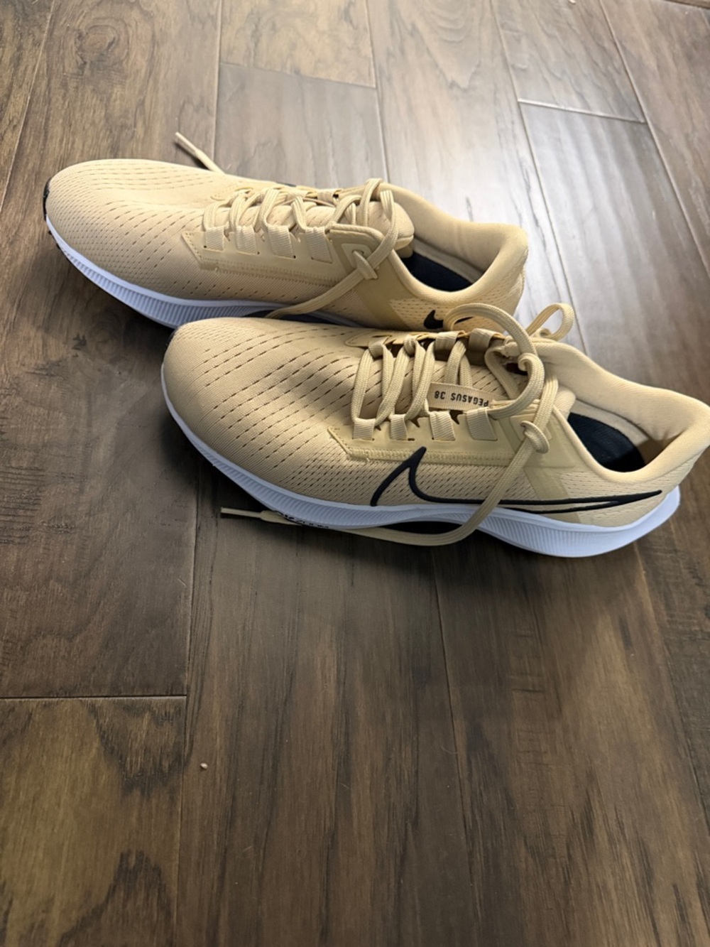 Nike Women's Athletic Sneakers in Gold with Black Swoosh